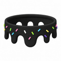 Black Drip Ring with colorful sprinkles on a white background
